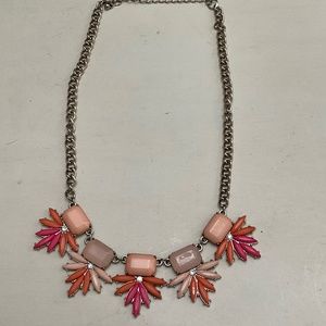 Statement necklace, peach and pink tones, gold chain.